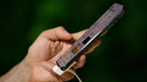 A man tests a Huawei smartphone at the Mobile World Congress (MWC) in Shanghai on June 28, 2023. (Photo by Pedro PARDO / AFP) (Photo by PEDRO PARDO/AFP via Getty Images)