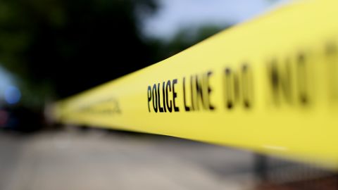 CHICAGO, ILLINOIS - JUNE 23: Police tape surrounds a crime scene where three people were shot at the Wentworth Gardens housing complex in the Bridgeport neighborhood on June 23, 2021 in Chicago, Illinois. A 24-year-old man died from injuries he suffered in the shooting and two others, a 22-year-old male and a 25-year-old male, were seriously wounded. (Photo by Scott Olson/Getty Images)