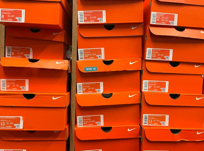 NOVATO, CALIFORNIA - SEPTEMBER 27: Stacks of Nike shoe boxes sit on a shelf at a shoe store on September 27, 2021 in Novato, California. Nike has had to downgrade its fiscal 2022 revenue outlook as the shoe company faces supply chain shortages that will impact inventories ahead of the holiday shopping season. (Photo by Justin Sullivan/Getty Images)