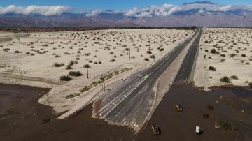 An aerial image shows no traffic on Interstate 10 due to flooding and mud crossing the highway following heavy rains from Tropical Storm Hilary, in Rancho Mirage, California, on August 21, 2023. Tropical Storm Hilary drenched Southern California with record rainfall, shutting down schools, roads and businesses before edging in on Nevada on August 21, 2023. California Governor Gavin Newsom had declared a state of emergency over much of the typically dry area, where flash flood warnings remained in effect until this morning. (Photo by DAVID SWANSON / AFP) (Photo by DAVID SWANSON/AFP via Getty Images)
