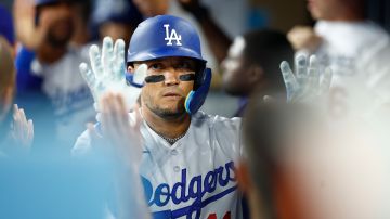LOS ANGELES, CALIFORNIA - AUGUST 15: Miguel Rojas #11 of the Los Angeles Dodgers celebrates a run against the Milwaukee Brewers in the fifth inning at Dodger Stadium on August 15, 2023 in Los Angeles, California. (Photo by Ronald Martinez/Getty Images)