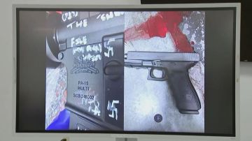 This video grab shows a press conference screen displaying a handgun found on the scene of a shooting in Jacksonville, Florida, August 26, 2023. A white man driven by racial hatred shot dead three Black people in a Florida discount store August 26 before taking his own life after a standoff with police, authorities said. "He targeted a certain group of people and that's Black people. That's what he said he wanted to kill. And that's very clear," Jacksonville Sheriff TK Waters told a news conference about the gunman, who was in his early 20s. (Photo by AFP) (Photo by -/AFP via Getty Images)