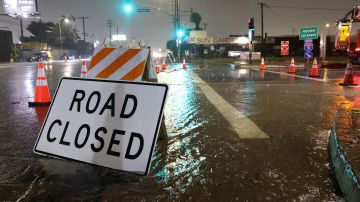 SUN VALLEY, CALIFORNIA - AUGUST 20: An entrance to southbound Interstate 5 is blocked due to flooding as tropical storm Hilary moves through the area on August 20, 2023 in Sun Valley, California. Southern California is under a first-ever tropical storm warning as Hilary impacts parts of California, Arizona and Nevada. All California state beaches have been closed in San Diego and Orange counties in preparation for the impacts from the storm which was downgraded from hurricane status. (Photo by Justin Sullivan/Getty Images)