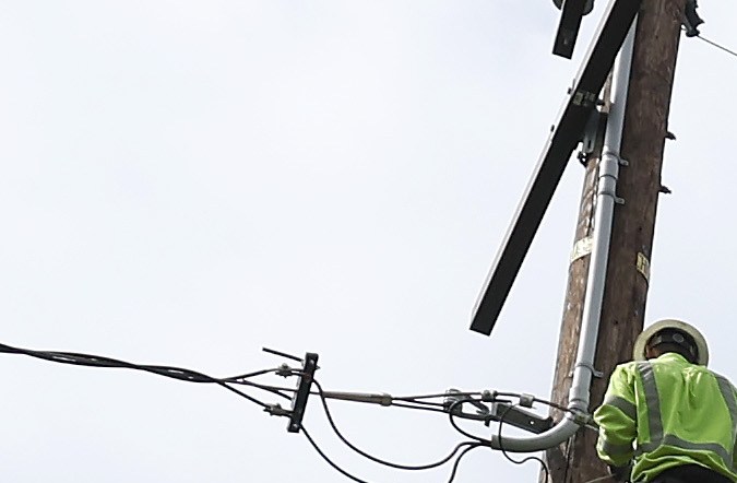SIERRA MADRE, CALIFORNIA - AUGUST 21: In an aerial view, utility workers repair an electrical line that was damaged by a falling tree during tropical storm Hilary on August 21, 2023 in Sierra Madre, California. Much of Southern California and parts of Arizona and Nevada are cleaning up after being impacted by the tropical storm that brought several inches of rain that flooded roadways and winds that toppled trees and power lines across the region. (Photo by Justin Sullivan/Getty Images)