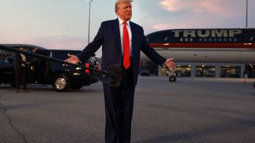 Former U.S. President Donald Trump speaks to the media at Atlanta Hartsfield-Jackson International Airport after surrendering at the Fulton County jail on August 24, 2023 in Atlanta, Georgia.