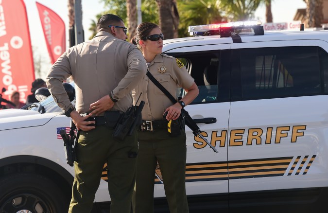 Armed officers from the Sheriff's department on patrol near the scene of the crime in San Bernardino, California on December 2, 2015. A man and a woman suspected of carrying out a deadly shooting at a center for the disabled in California were killed in a shootout with police, while a third person was detained, police said. AFP PHOTO / FREDERIC J. BROWN / AFP / FREDERIC J. BROWN (Photo credit should read FREDERIC J. BROWN/AFP via Getty Images)