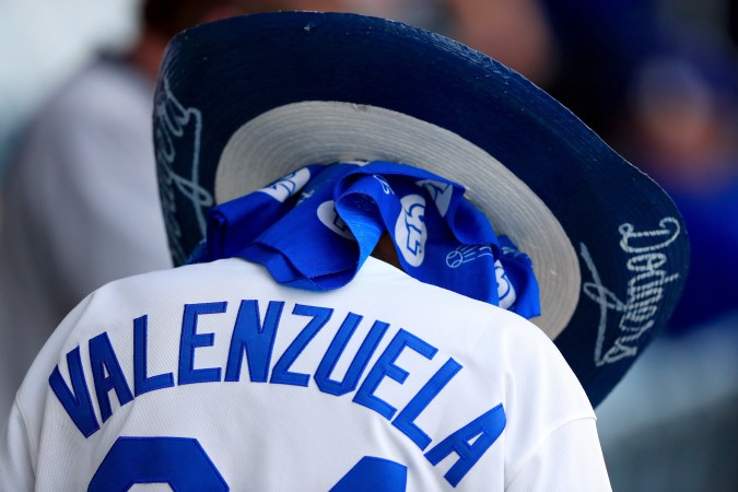 LOS ANGELES, CA - NOVEMBER 01: A fan wearing a Fernando Valenzuela jersey attends game seven of the 2017 World Series between the Houston Astros and the Los Angeles Dodgers at Dodger Stadium on November 1, 2017 in Los Angeles, California. (Photo by Sean M. Haffey/Getty Images)