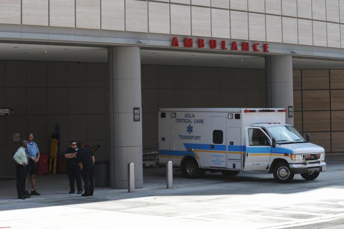 Police block the entrance of the emergency room at the UCLA Medical Center after the reported death of US singer Michael Jackson, who was taken to the hospital in Los Angeles on June 25, 2009. Pop icon Michael Jackson died June 25, 2009 after suffering a cardiac arrest, multiple US media outlets reported, sending shockwaves around the entertainment world. AFP PHOTO / Mark RALSTON (Photo credit should read MARK RALSTON/AFP via Getty Images)