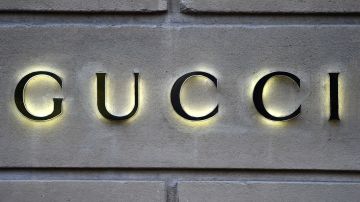 This picture taken on December 19, 2017 shows a logo outside the fashion house and luxury goods Gucci shop on the Avenue Montaigne in Paris, ahead of Christmas. (Photo by STEPHANE DE SAKUTIN / AFP) (Photo by STEPHANE DE SAKUTIN/AFP via Getty Images)