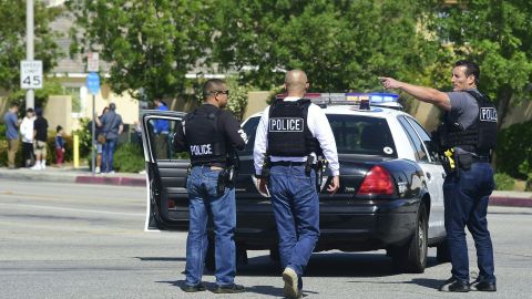 Police man an intersection May 11, 2018 following reports of shooting at Highland High School in Palmdale, 40 miles (65 kilometers) north of downtown Los Angeles. - Police arrested a man after reports of shootings at two schools near Los Angeles, the local sheriff's department and education officials said. The Los Angeles County Sheriff said one suspect had been detained "regarding the person with a gun" at Highland High School. Local news reports had earlier said that at least one person had been wounded. It was not immediately clear what type of weapon the man had. (Photo by Frederic J. BROWN / AFP) (Photo credit should read FREDERIC J. BROWN/AFP via Getty Images)