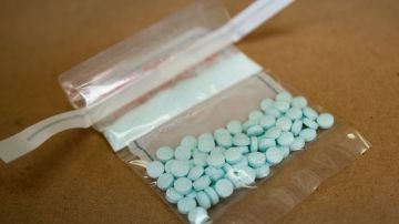 Tablets believed to be laced with fentanyl are displayed at the Drug Enforcement Administration Northeast Regional Laboratory on October 8, 2019 in New York. - According to US government data, about 32,000 Americans died from opioid overdoses in 2018. That accounts for 46 percent of all fatal overdoses. Fentanyl, a powerful painkiller approved by the US Food and Drug Administration for a range of conditions, has been central to the American opioid crisis which began in the late 1990s. (Photo by Don EMMERT / AFP) (Photo by DON EMMERT/AFP via Getty Images)
