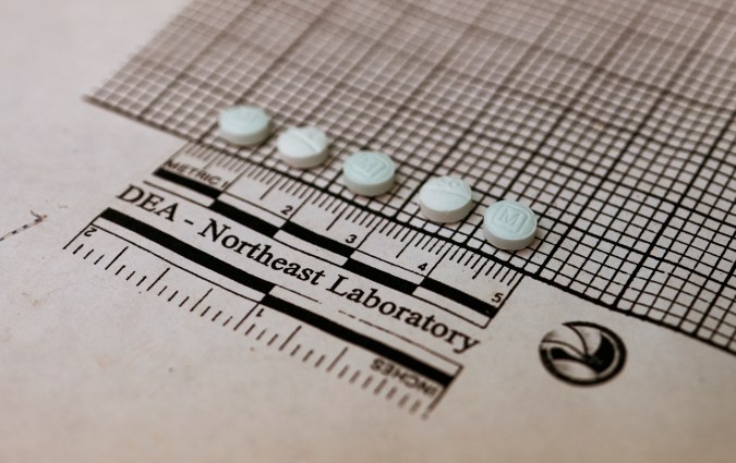 Tablets suspected to be fentanyl are placed on a graph to measure their size at the Drug Enforcement Administration Northeast Regional Laboratory on October 8, 2019 in New York. - According to US government data, about 32,000 Americans died from opioid overdoses in 2018. That accounts for 46 percent of all fatal overdoses. Fentanyl, a powerful painkiller approved by the US Food and Drug Administration for a range of conditions, has been central to the American opioid crisis which began in the late 1990s. (Photo by Don EMMERT / AFP) (Photo by DON EMMERT/AFP via Getty Images)