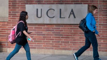 People walk through the campus of the UCLA college in Westwood, California on March 6, 2020. - Three UCLA students are currently being tested for the COVID-19 (coronavirus) by the LA Departement of Public Health, according to the UCLA Chancellor Gene Block. (Photo by Mark RALSTON / AFP) (Photo by MARK RALSTON/AFP via Getty Images)