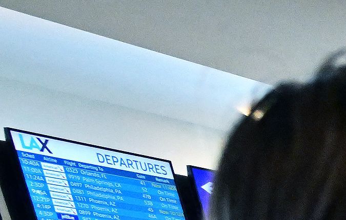 Travellers check in on the depatures level at Los Angeles International Airport (LAX) on July 1, 2022, ahead of the July 4th holiday weekend. - US airlines are bracing customers for what will probably be another bumpy holiday weekend as the industry struggles to manage a surge in travel demand that probably exceeds its current capacity. (Photo by Frederic J. BROWN / AFP) (Photo by FREDERIC J. BROWN/AFP via Getty Images)