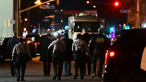 Investigators from the Los Angeles County Sheriff's Department Homicide bureau walk away after briefing the media in Monterey Park, California on January 22, 2023. - Ten people have died and at least 10 others been wounded in a mass shooting in a largely Asian city in southern California, law enforcement said January 22, with the suspect still at large hours later. (Photo by Frederic J. BROWN / AFP) (Photo by FREDERIC J. BROWN/AFP via Getty Images)