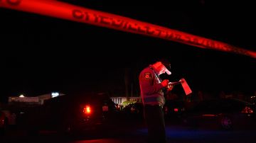 TOPSHOT - A San Mateo County sheriff deputy stands at the scene of a shooting on highway 92 in Half Moon Bay, California on January 23, 2023. - An Asian farm worker was in custody January 23, 2023 after seven of his colleagues were killed in front of children at sites in California, days after a mass shooter killed 11 people at a Lunar New Year celebration near Los Angeles. The latest bloodshed to hit Asian Americans in California occurred at two farms around Half Moon Bay, a coastal community near San Francisco. (Photo by Susana BATES / AFP) (Photo by SUSANA BATES/AFP via Getty Images)