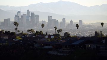 Palm trees stand above homes on the skyline in front of downtown Los Angeles after sunrise following heavy rain from winter storms, as seen from the Kenneth Hahn State Recreation Area, on March 2, 2023, in Los Angeles, California. (Photo by Patrick T. Fallon / AFP) (Photo by PATRICK T. FALLON/AFP via Getty Images)