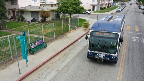 An DASH bus drives past La Sombrita, a prototype bus stop structure to provide shade during the day and solar-powered lighting at night installed by the Los Angeles Department of Transportation (LADOT) as a grant-funded pilot project for bus transit patrons, stands in the Watts neighborhood of Los Angeles, California on May 25, 2023. (Photo by Patrick T. Fallon / AFP) (Photo by PATRICK T. FALLON/AFP via Getty Images)