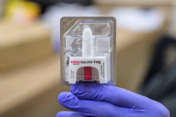 A staff member holds a Narcan nasal spray, used to treat narcotic overdoses in an emergency situation, at St. Ann's Corner of Harm Reduction in New York City on April 24, 2023. The tranquillizer, approved for veterinary use by the US Food and Drug Administration (FDA), has infiltrated the illegal drugs market in the US, with producers increasingly using it to augment fentanyl. Overdose deaths where tranq was detected have soared in recent years and in April the White House designated the drug an "emerging threat." (Photo by ANGELA WEISS / AFP) (Photo by ANGELA WEISS/AFP via Getty Images)