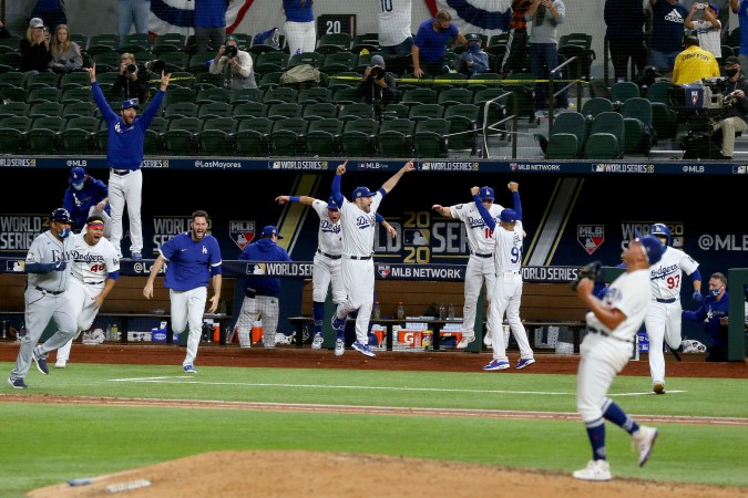 ARLINGTON, TEXAS - OCTOBER 27: The Los Angeles Dodgers celebrate after Julio Urias #7 strikes out Willy Adames , of the Tampa Bay Rays to give the Dodgers the 3-1 victory in Game Six to win the 2020 MLB World Series at Globe Life Field on October 27, 2020 in Arlington, Texas. (Photo by Tom Pennington/Getty Images)