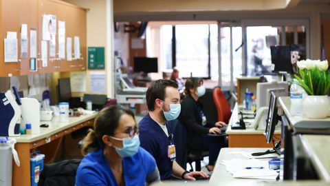 APPLE VALLEY, CALIFORNIA - MARCH 11: (EDITORIAL USE ONLY) Jesse Cabe (C) and other registered nurses work in the ICU at Providence St. Mary Medical Center on March 11, 2022 in Apple Valley, California. The hospital was treating 125 confirmed COVID-19 patients at the peak of the Omicron surge but has seen a sharp decline and is currently caring for 13 confirmed coronavirus patients. Today marks the two year anniversary of the World Health Organization’s official declaration of the COVID-19 pandemic. (Photo by Mario Tama/Getty Images)