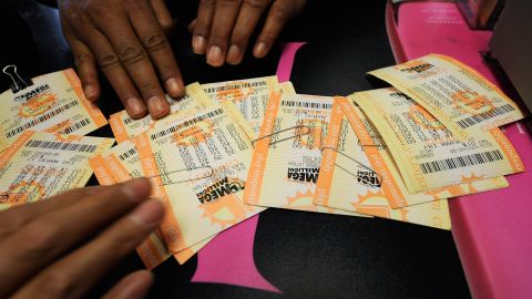 HAWTHORNE, CA - MARCH 29: Milton Smith picks up $1080 worth of Mega Millions lottery tickets after buying them from Bluebird liquor store on March 29, 2012 in Hawthorne, California. The Mega Millions jackpot has reached a record high of $540 million (Photo by Kevork Djansezian/Getty Images)