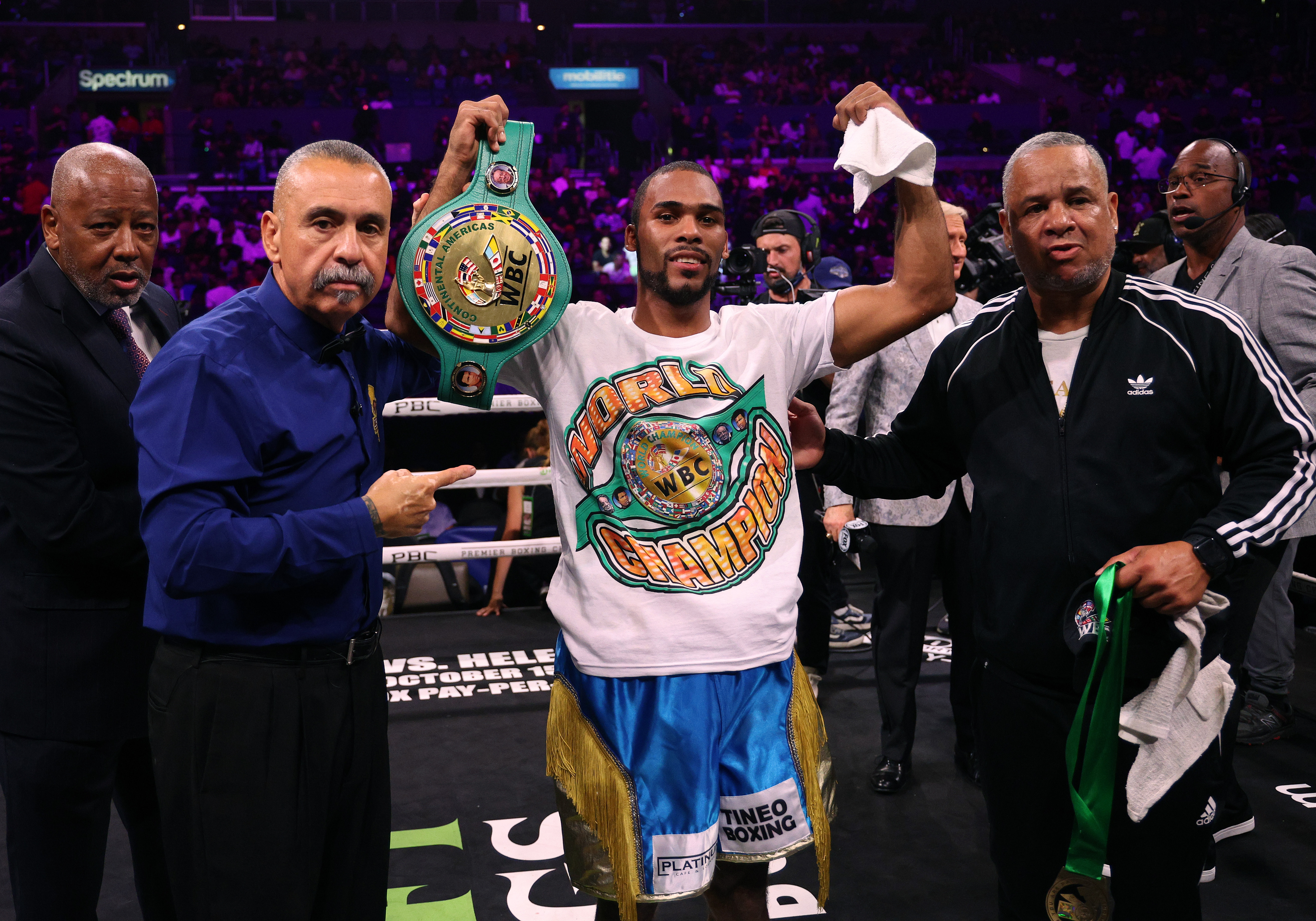 Edwin De Los Santos poses with the belt after defeating Jose Valenzuela.  Photos: Harry Howe/Getty Images. 