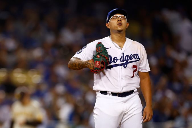 LOS ANGELES, CALIFORNIA - OCTOBER 11: Julio Urias #7 of the Los Angeles Dodgers takes a deep breath before a pitch during the second inning in game one of the National League Division Series against the San Diego Padres at Dodger Stadium on October 11, 2022 in Los Angeles, California. (Photo by Ronald Martinez/Getty Images)
