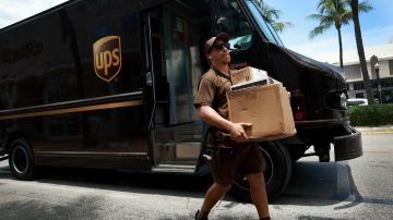 MIAMI, FLORIDA - JUNE 30: A UPS driver makes a delivery on June 30, 2023 in Miami, Florida. The union representing UPS workers announced a strike is "imminent" if the company doesn't come to the table with a significantly improved financial offer by Friday. The Teamsters Union has been negotiating with UPS for months on a new contract. (Photo by Joe Raedle/Getty Images)