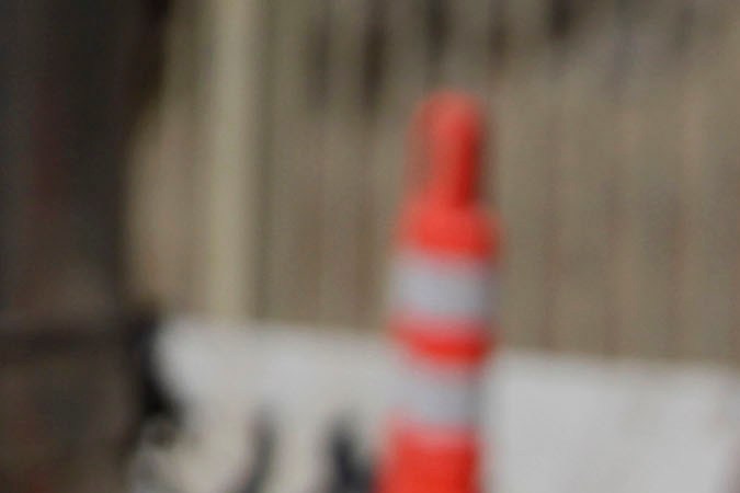 LOS ANGELES, CA - SEPTEMBER 29: A Los Angeles traffic officer assists a driver at the road closure where construction crews are demolishing a portion of the Mulholland Drive bridge that spans the 405 Freeway September 29, 2012 in Los Angeles, California. The 405 Freeway is completely shut down for a 10 mile stretch this weekend for the demolition that is part of a larger $1-billion freeway improvement project. (Photo by Jonathan Alcorn/Getty Images)