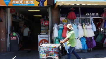 LOS ANGELES, CALIFORNIA - JULY 20: An ice cream vendor walks past Las Palmitas Mini Market on July 20, 2023 in Los Angeles California. The $1.08 billion winning Powerball ticket was sold at the Las Palmitas Mini Market for the July 19th drawing. The jackpot is the third largest in Powerball history and was picked after three months of drawings without a winner. The mini market is located in the downtown Fashion District close to Skid Row. (Photo by Mario Tama/Getty Images)