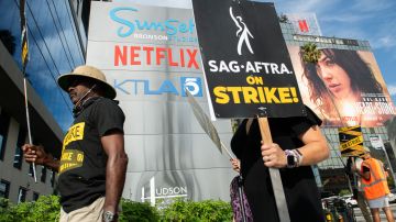 Members of the Screen Actors Guild walk a picket line outside of Netflix in Los Angeles, California, on September 27, 2023. The Writers Guild of America has been on strike since early May and the SAG-AFTRA actors' union joined the writers on the picket lines in July. (Photo by VALERIE MACON / AFP) (Photo by VALERIE MACON/AFP via Getty Images)