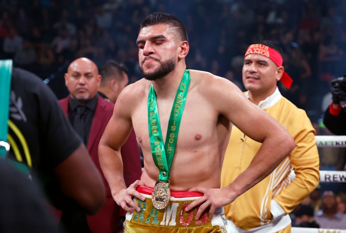 LAS VEGAS, NEVADA - SEPTEMBER 30: Jesus Ramos Jr. (gold trunks) reacts after being defeated by Erickson Lubin (red trunks) in a unanimous decision in their super welterweight fight at T-Mobile Arena on September 30, 2023 in Las Vegas, Nevada. (Photo by Sarah Stier/Getty Images)
