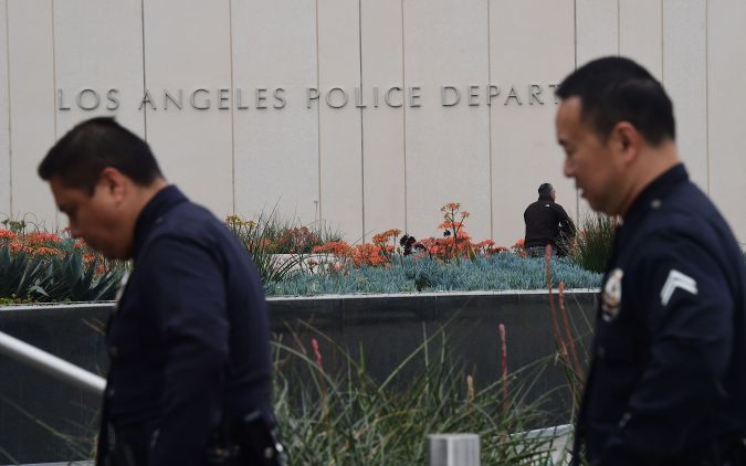 LAPD officers return to headquarters on March 4, 2016, folllowing a press conference where Los Angeles police announced an investigation into whether a knife purportedly found on property once owned by O.J. Simpson is evidence in the murder of Nicole Brown Simpson and Ronald Goldman. Los Angeles police are investigating and testing a knife that was allegedly recovered on property once owned by former football star O.J. Simpson, a spokesman said Friday. / AFP / FREDERIC J. BROWN (Photo credit should read FREDERIC J. BROWN/AFP via Getty Images)