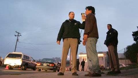 SAN FRANCISCO - DECEMBER 26: California Highway Patrol officer Mike Robinson (L) administers a breathalizer test to a man as his partner Mark Rossetti (R) looks on at a sobriety checkpoint December 26, 2004 in San Francisco, California. The California Highway Patrol reported a total of 1,481 driving under the influence arrests since the Dec. 17, the start of the AVOID regional campaign against drunken driving. AVOID, a regional force of 125 police departments in the San Francisco Bay Area, runs its annual ANTI-DUI campaign from December 17th through January 2nd. (Photo by Justin Sullivan/Getty Images)