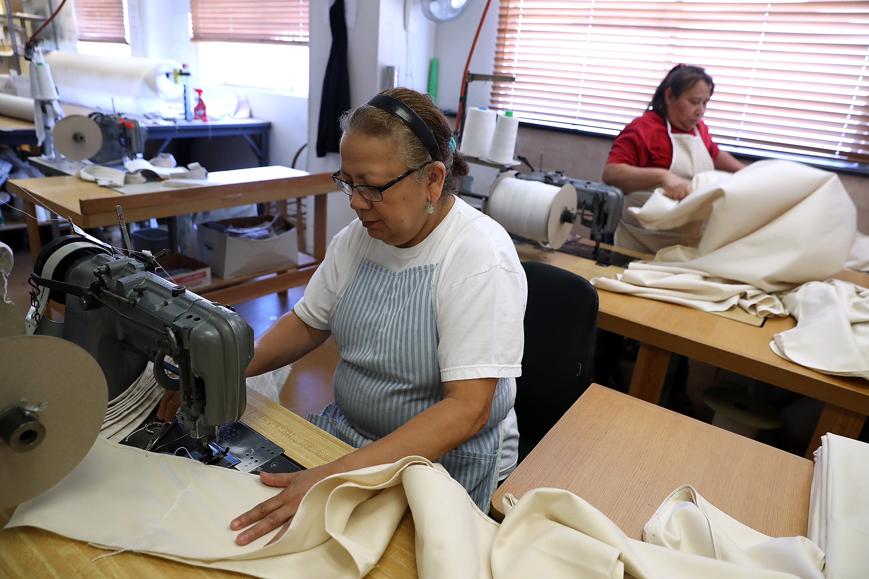 SAN FRANCISCO, CA - AUGUST 09: Workers operate sewing machines at McRoskey Mattress Company on August 9, 2016 in San Francisco, California. According to a report by the U.S. Labor Department, nonfarm business productivity dropped for the third consecutive quarter at an annual rate of 0.5% in the second quarter. (Photo by Justin Sullivan/Getty Images)