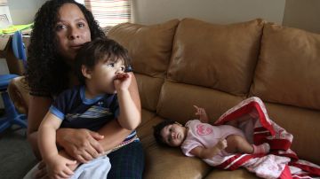 LOS ANGELES, CA - JUNE 11: Lisette Guevara and her children, three-month-old Iliana and two-year-old Angel, are among four families in an apartment building who are facing eviction on June 11, 2009 in the Los Angeles-area community of North Hollywood, California. Most of the tenants are low-income Latino immigrant families who have lived in the building that has been in need of repairs for as many as 10 years. They have until June 19 to move out. Fair housing advocates feel that the bank should have put more energy into making sure the property was habitable than in evicting the renters. The building is one of 50 sites across the country where housing advocates are holding actions today. (Photo by David McNew/Getty Images)