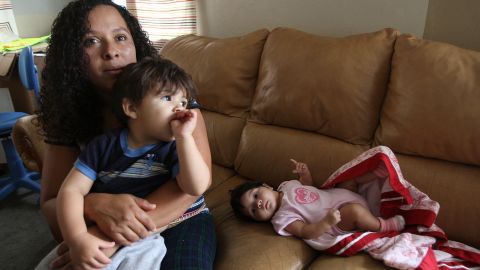 LOS ANGELES, CA - JUNE 11: Lisette Guevara and her children, three-month-old Iliana and two-year-old Angel, are among four families in an apartment building who are facing eviction on June 11, 2009 in the Los Angeles-area community of North Hollywood, California. Most of the tenants are low-income Latino immigrant families who have lived in the building that has been in need of repairs for as many as 10 years. They have until June 19 to move out. Fair housing advocates feel that the bank should have put more energy into making sure the property was habitable than in evicting the renters. The building is one of 50 sites across the country where housing advocates are holding actions today. (Photo by David McNew/Getty Images)