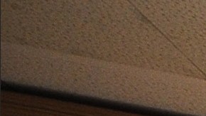 A cameraman records the judge's podium in a courtroom closed due to budget cuts and layoffs, at the Stanley Mosk Courthouse in downtown Los Angeles on March 16, 2009. Beset by an unprecedented budget crisis, the LA Superior Court, the largest trial court system in the US, laid off 329 employees and announced the closure of 17 courtrooms, with more of both expected in the future. AFP PHOTO/Robyn BECK (Photo credit should read ROBYN BECK/AFP via Getty Images)