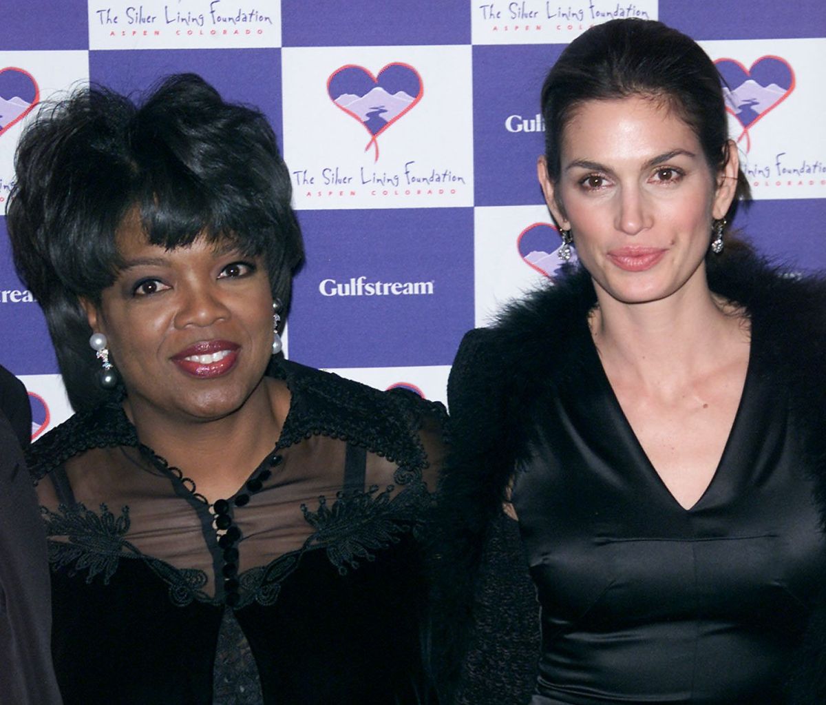 Oprah Winfrey y Cindy Crawford en un evento benéfico en 2011.
