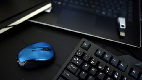 This photo illustration taken on August 13, 2021 shows a home office desk with a keyboard, a mouse and a laptop in Los Angeles, California. - In the United States, companies are delaying one after another the return of their employees to the office, worried about the new wave of contaminations with the spread of the Delta variant. (Photo by - / AFP) (Photo by -/AFP via Getty Images)