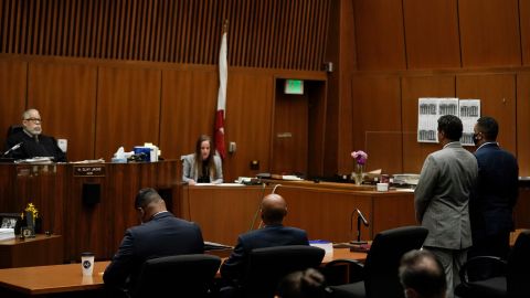 LOS ANGELES, CA - JULY 06: Eric Holder Jr., far right, who is accused of killing rapper Nipsey Hussle, his attorney, Aaron Jansen, and Judge H. Clay Jacke, far left, listen as court clerk Sarah Girardot reads the verdict in a courtroom at Los Angeles Superior Court on July 6, 2022 in Los Angeles, California. Jurors have found the 32-year-old man guilty of first-degree murder for the 2019 fatal shooting of the rapper. (Photo by Jae C. Hong - Pool/Getty Images)