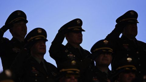 Police officers salute Colombian President Gustavo Petro during a ceremony to appoint General Henry Sanabria as Police Director at the General Santander Police School in Bogota, on August 19, 2022. (Photo by DANIEL MUNOZ / AFP) (Photo by DANIEL MUNOZ/AFP via Getty Images)