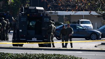 Law enforcement personnel are seen outside the site in Torrance, California, where the alleged suspect in the mass shooting in which 10 people were killed in Monterey Park, California, is believed to be holed up on January 22, 2023. - Police were involved in a stand-off Sunday with a man they believe killed 10 people in a mass shooting at a dance club during Lunar New Year celebrations in California. At least 10 other people were wounded in the shooting with the gunman -- described by police as Asian -- firing indiscriminately at the club in Monterey Park, near Los Angeles, witnesses said. (Photo by Robyn BECK / AFP) (Photo by ROBYN BECK/AFP via Getty Images)