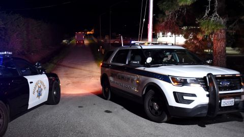 A Highway Patrol and a San Mateo County sheriff cars are seen at the scene of a shooting at Cabrillo Highway in Half Moon Bay, California on January 23, 2023. - An Asian farm worker was in custody January 23, 2023 after seven of his colleagues were killed in front of children at sites in California, days after a mass shooter killed 11 people at a Lunar New Year celebration near Los Angeles. The latest bloodshed to hit Asian Americans in California occurred at two farms around Half Moon Bay, a coastal community near San Francisco. (Photo by Susana BATES / AFP) (Photo by SUSANA BATES/AFP via Getty Images)