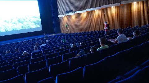 BERLIN, GERMANY - JULY 02: People arrive to watch a late night film at Kino International on the first day that cinemas reopened in Berlin during the novel coronavirus pandemic on July 02, 2020 in Berlin, Germany. Germany is continuing to lift lockdown restrictions nationwide while at the same time remaining wary of possible further outbreaks. (Photo by Sean Gallup/Getty Images)