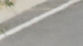 LOS ANGELES, CALIFORNIA - JULY 08: A man bicycles past motorists entering and departing the COVID-19 testing center at Dodger Stadium amid the coronavirus pandemic on July 08, 2020 in Los Angeles, California. California posted a record 9,500 new coronavirus cases today, the most in one day in the state since the beginning of the pandemic. (Photo by Mario Tama/Getty Images)