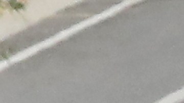 LOS ANGELES, CALIFORNIA - JULY 08: A man bicycles past motorists entering and departing the COVID-19 testing center at Dodger Stadium amid the coronavirus pandemic on July 08, 2020 in Los Angeles, California. California posted a record 9,500 new coronavirus cases today, the most in one day in the state since the beginning of the pandemic. (Photo by Mario Tama/Getty Images)