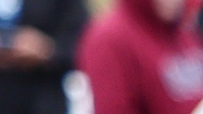 SAN DIEGO, CALIFORNIA - MAY 13: Federal law enforcement agents and officers keep watch as immigrants line up (R) to be transported from a makeshift camp between border walls between the U.S. and Mexico on May 13, 2023 in San Diego, California. Some of the immigrants at the open air camp have been waiting for days in limbo for a chance to plead for asylum while local volunteer groups are providing food and other necessities. The U.S. government's Covid-era Title 42 policy, which for the past three years had allowed for the quick expulsion of irregular migrants entering the country, expired on the evening of May 11. (Photo by Mario Tama/Getty Images)
