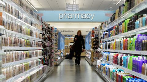 HOLLYWOOD, CA - JANUARY 15: A woman shops in a new Walgreens at the corner of Sunset and Vine on January 15, 2013 in Hollywood, California. The new 23,500-square-foot, drugstore, the company's 8,000th store and first West Coast flagship, includes high-end cosmetic, skinand hair care brands, a frozen yogurt station, a fresh sushi bar, a coffee and espresso bar, a juice and smoothie bar, a wine and spirits shop with a and a virtual bartender kiosk and a cigar humidor. (Photo by Kevork Djansezian/Getty Images)